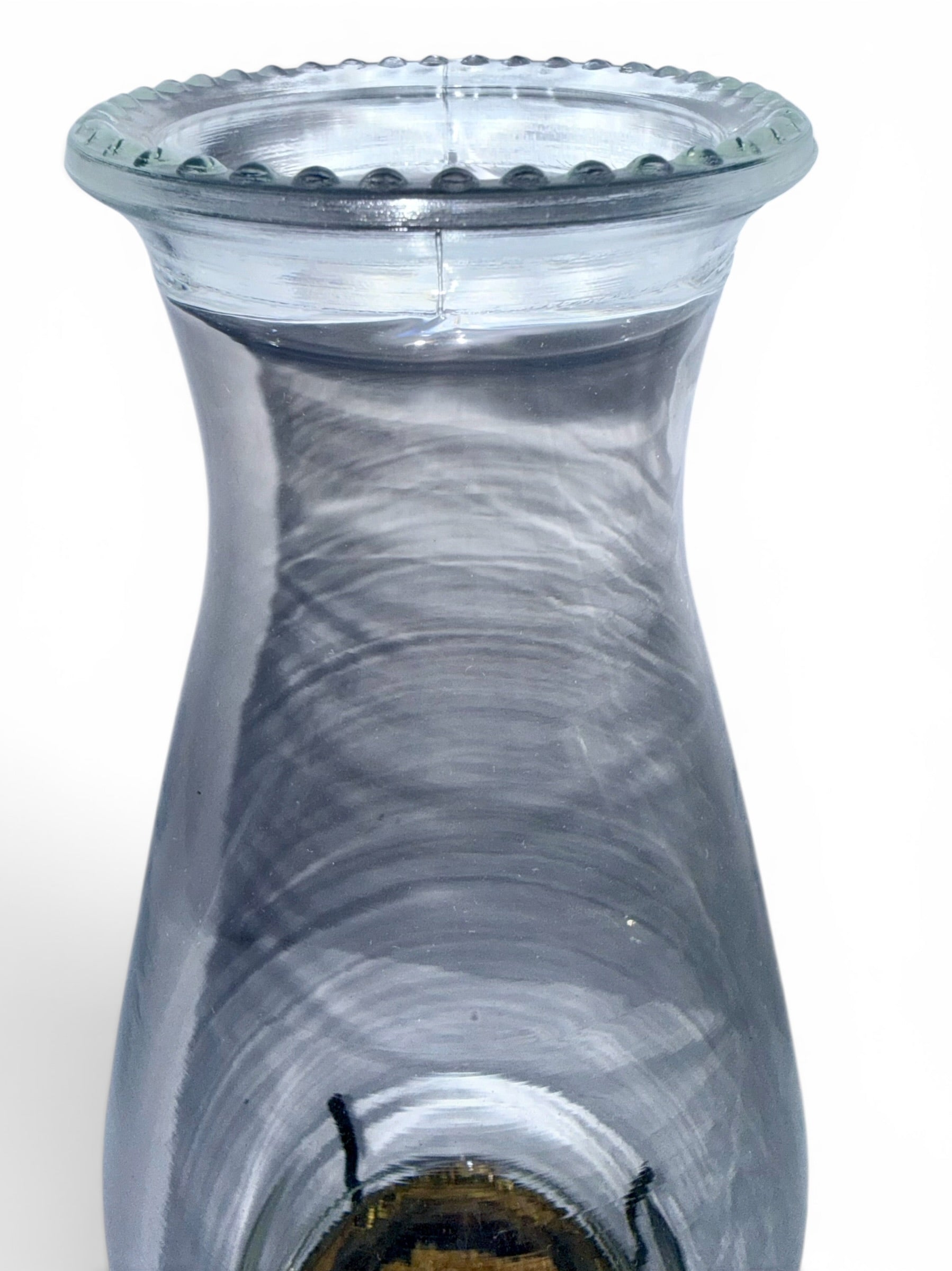 Clear glass oil lamp chimney on a white background