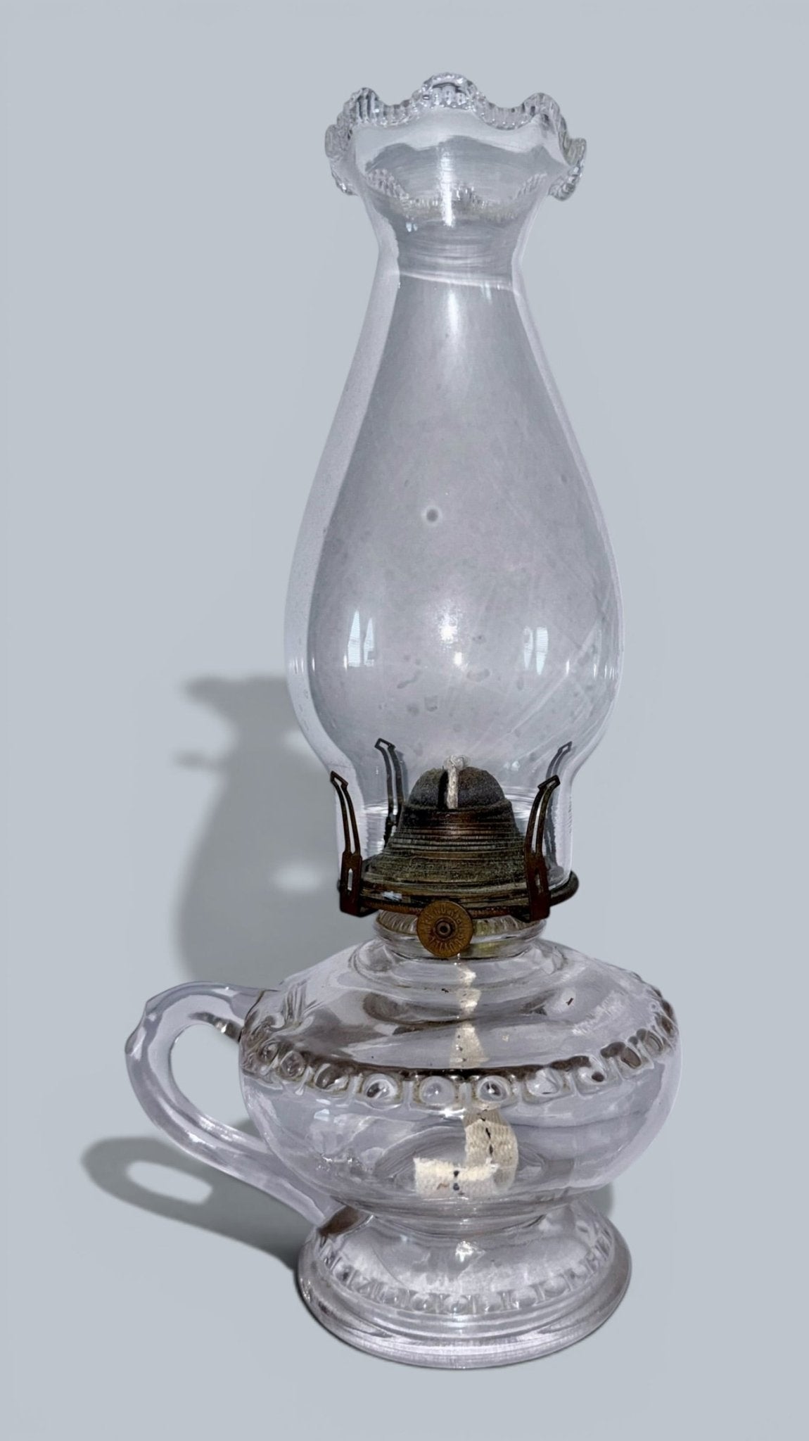 Antique Kerosene or Oil Bedside Footed Finger / Hand Lamp Complete w/ Chimney & Burner - AntiquesEtceteraAntique Kerosene or Oil Bedside Footed Finger / Hand Lamp Complete w/ Chimney & BurnerAntique Oil LampAntiquesEtceteraAntiquesEtcetera
