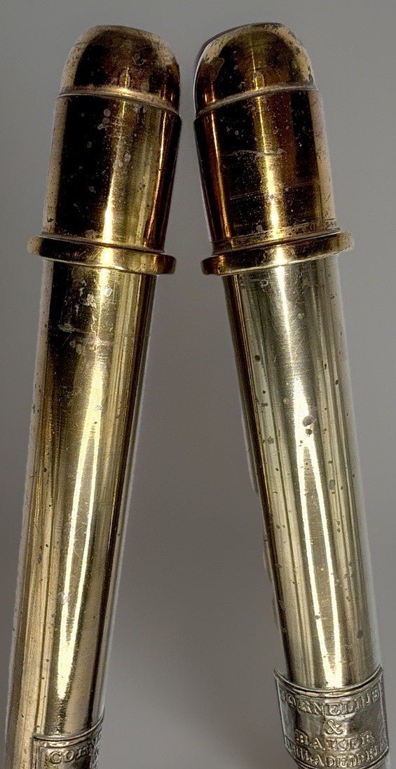 Cornelius & Baker Philadelphia Brass Candlesticks with Emblem & Wax Catcher Base - AntiquesEtceteraCornelius & Baker Philadelphia Brass Candlesticks with Emblem & Wax Catcher BaseAntiquesEtceteraAntiquesEtcetera