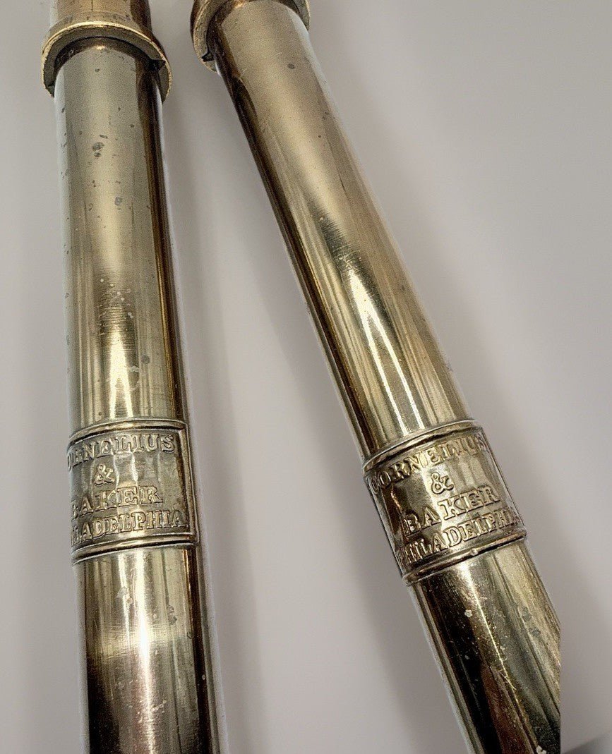 Cornelius & Baker Philadelphia Brass Candlesticks with Emblem & Wax Catcher Base - AntiquesEtceteraCornelius & Baker Philadelphia Brass Candlesticks with Emblem & Wax Catcher BaseAntiquesEtceteraAntiquesEtcetera