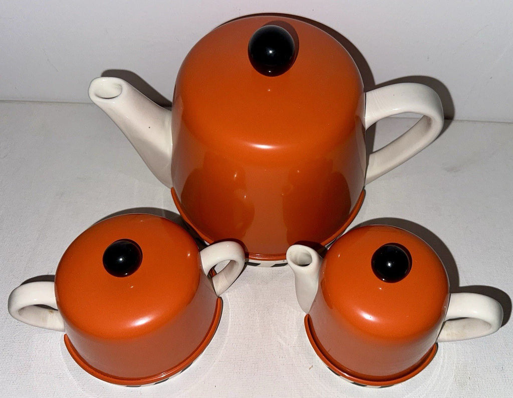 Geoffrey Beene Swid Powell Tea Set with Pot, Sugar, Creamer Insulated Orange Tin - AntiquesEtceteraGeoffrey Beene Swid Powell Tea Set with Pot, Sugar, Creamer Insulated Orange TinSwid PowellAntiquesEtcetera