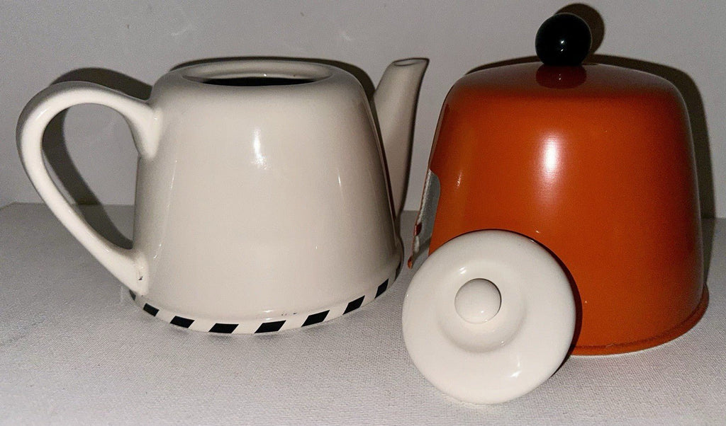 Geoffrey Beene Swid Powell Tea Set with Pot, Sugar, Creamer Insulated Orange Tin - AntiquesEtceteraGeoffrey Beene Swid Powell Tea Set with Pot, Sugar, Creamer Insulated Orange TinSwid PowellAntiquesEtcetera