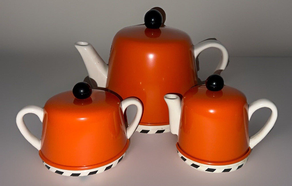 Geoffrey Beene Swid Powell Tea Set with Pot, Sugar, Creamer Insulated Orange Tin - AntiquesEtceteraGeoffrey Beene Swid Powell Tea Set with Pot, Sugar, Creamer Insulated Orange TinSwid PowellAntiquesEtcetera
