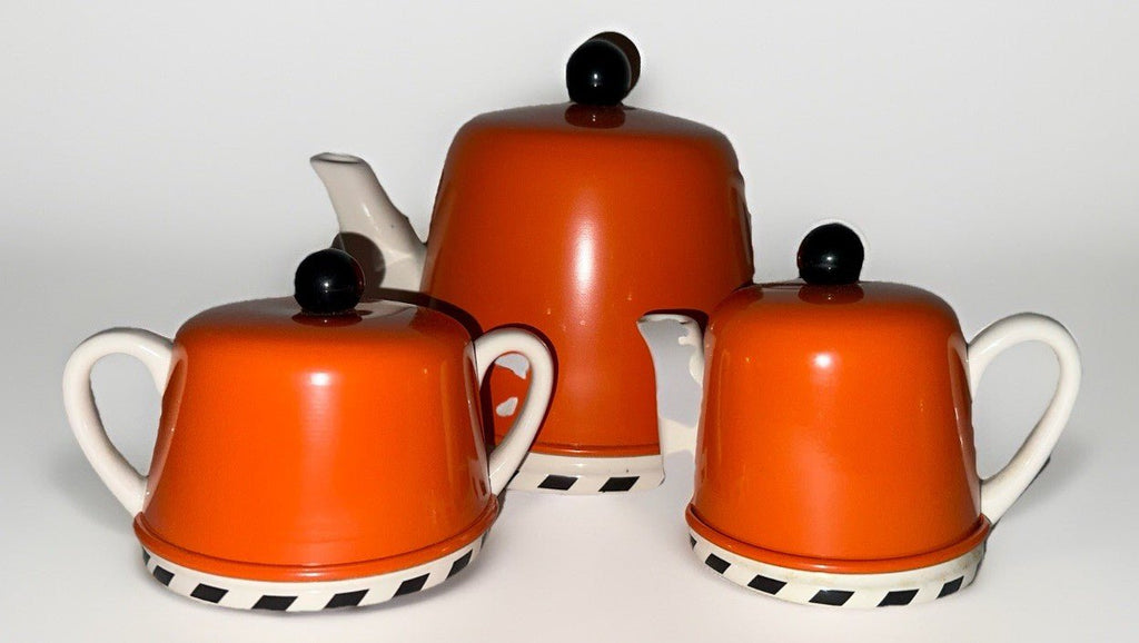 Geoffrey Beene Swid Powell Tea Set with Pot, Sugar, Creamer Insulated Orange Tin - AntiquesEtceteraGeoffrey Beene Swid Powell Tea Set with Pot, Sugar, Creamer Insulated Orange TinSwid PowellAntiquesEtcetera